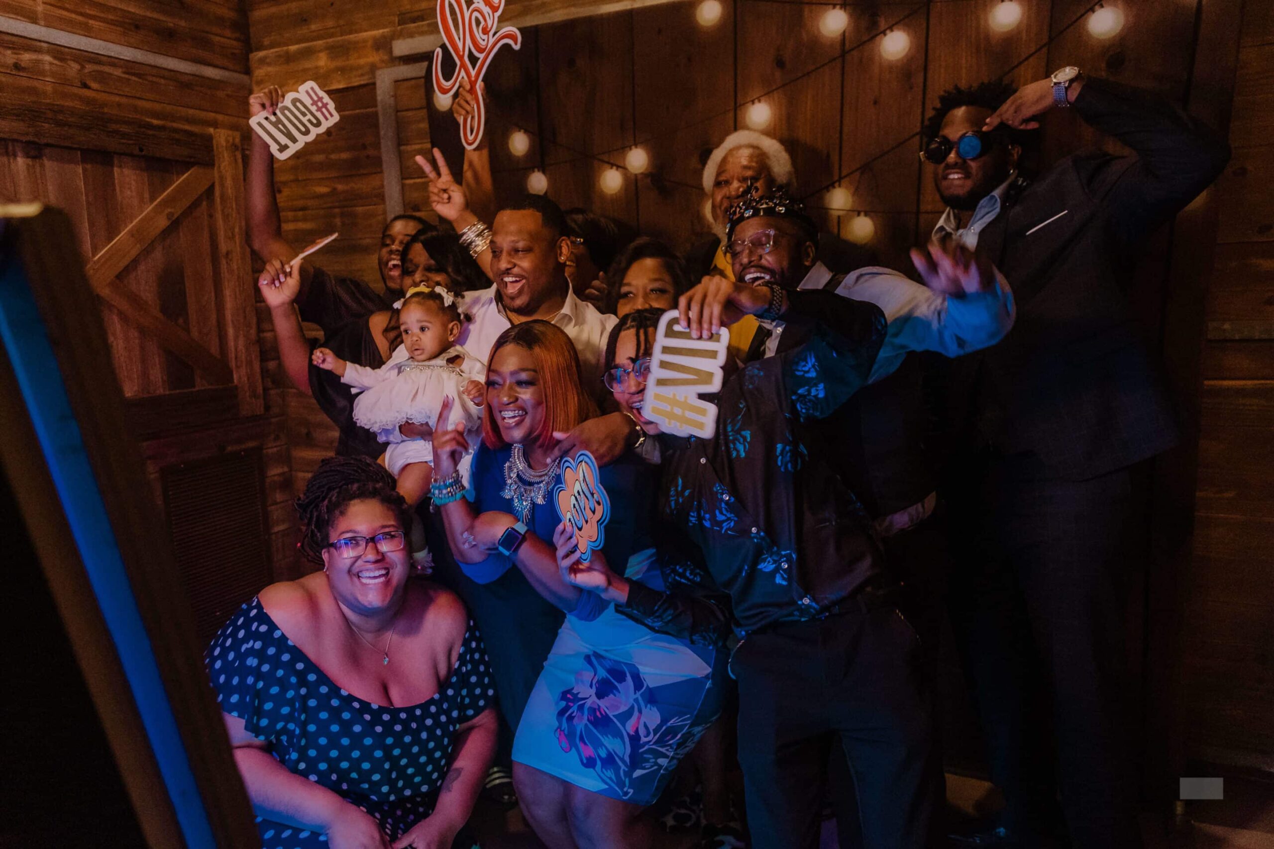 Crowd of guests celebrating together at a festive indoor party