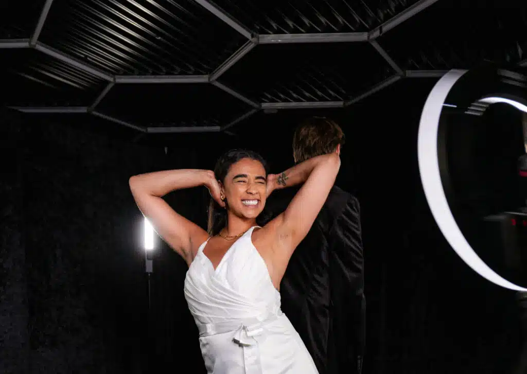 Woman posing beneath a hexagon LED light ceiling