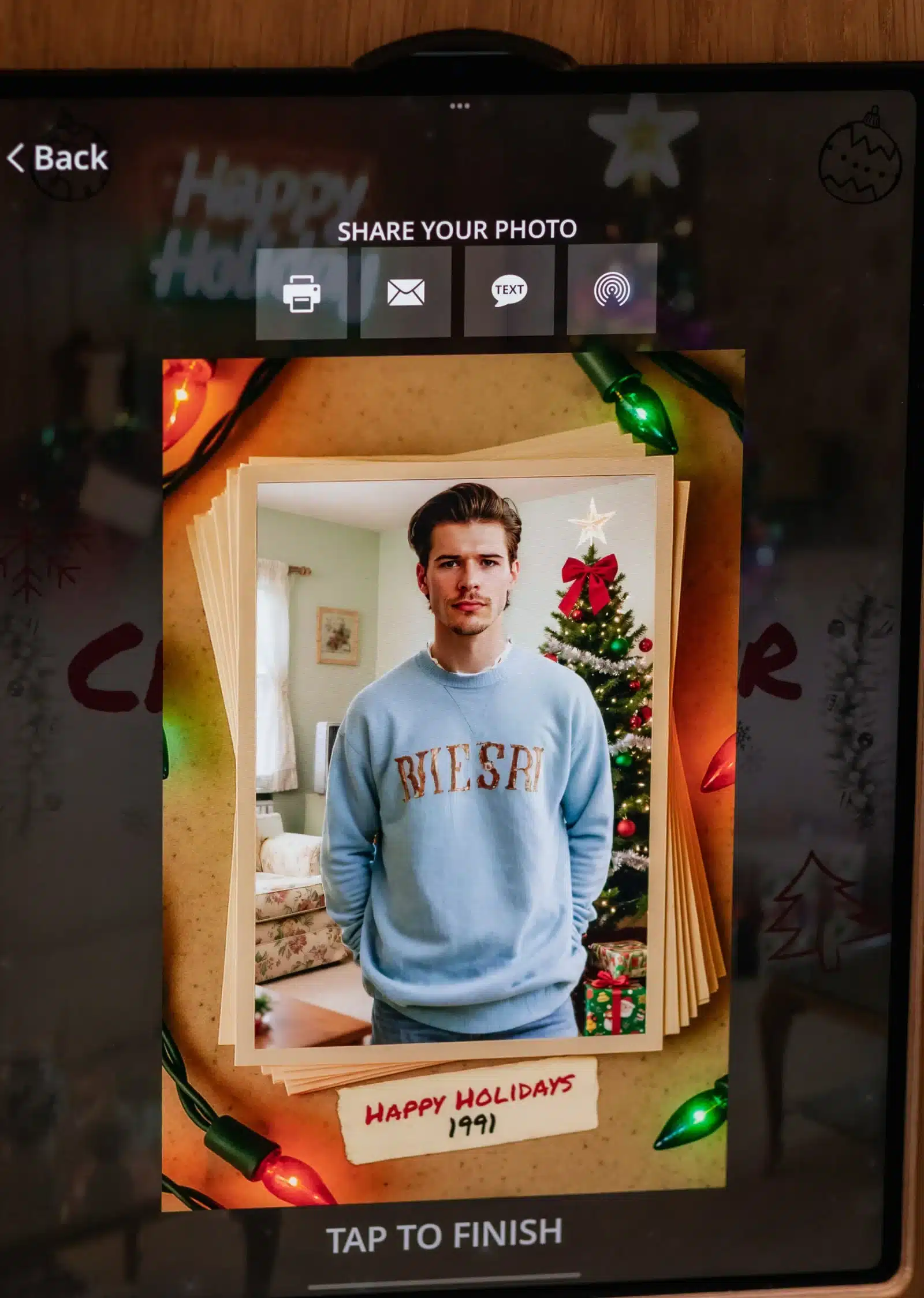 Photo booth sharing screen displaying a guest's photo in a holiday frame