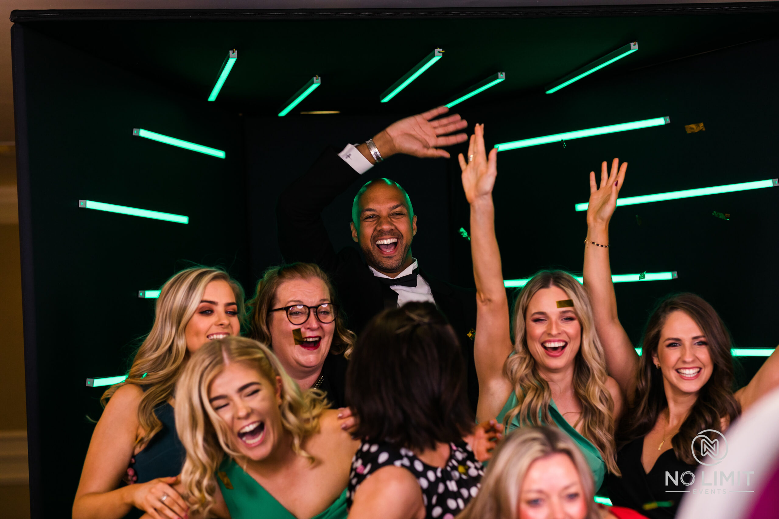 A group of partygoers having fun posing for photos