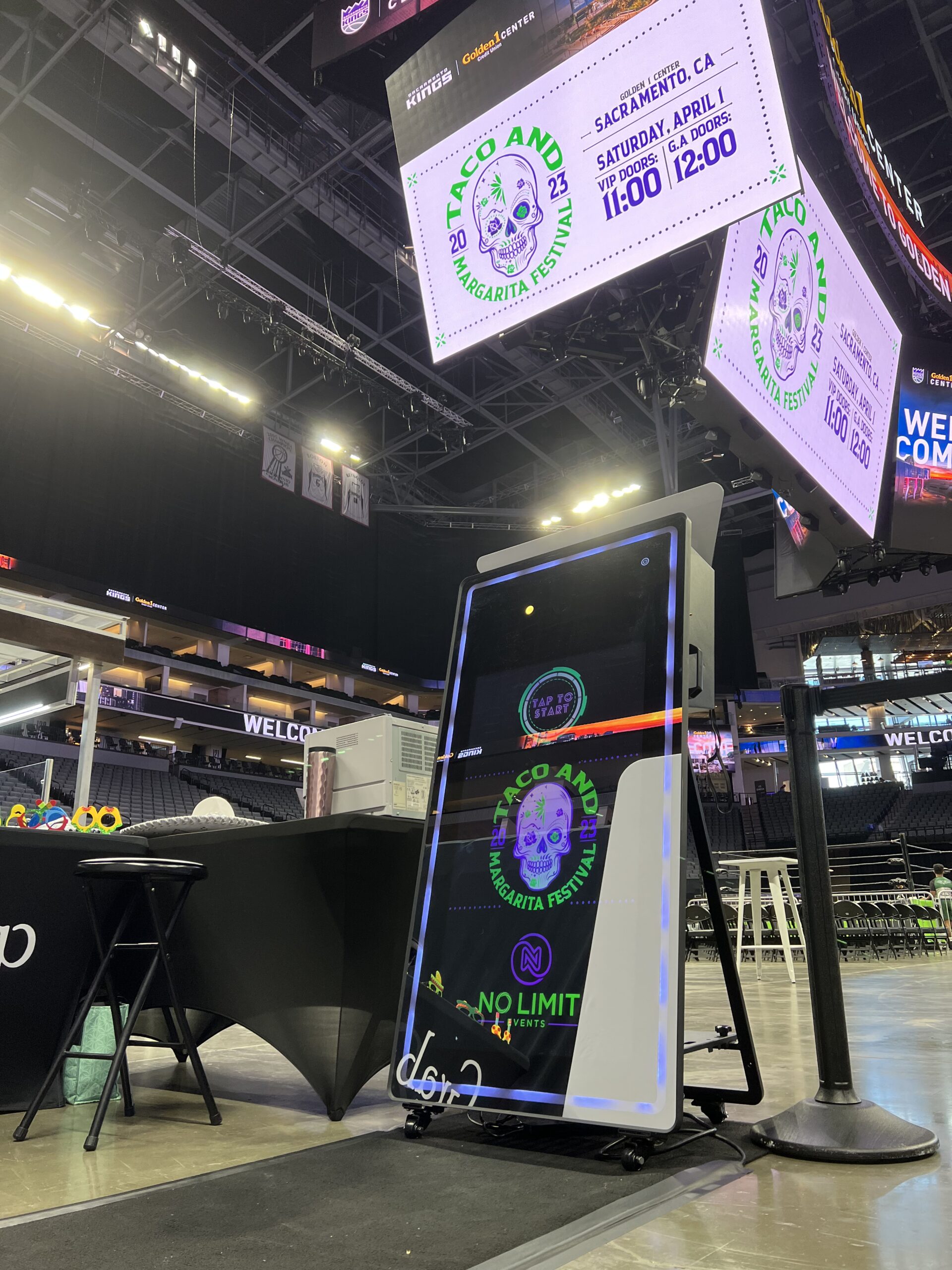 LED-lit photo booth set up inside an arena before an event